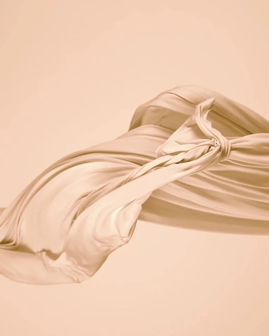 Flowing silk fabric in soft pink and gold